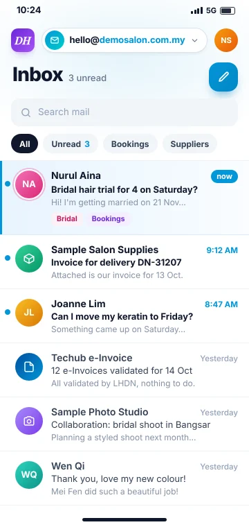 Email on your phone A new customer enquiry arriving in the salon's business email inbox on a phone