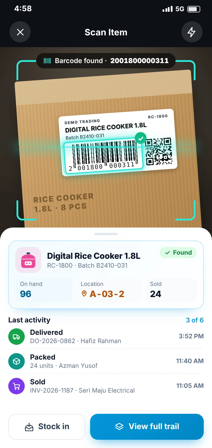 Phone camera scanning a carton barcode to find the item, its stock on hand, rack location and last activity