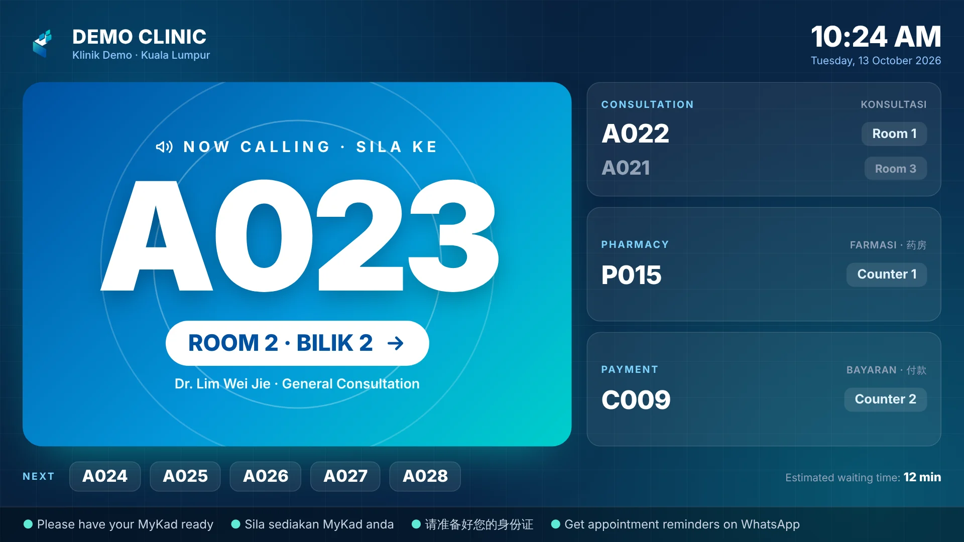 Clinic queue number calling TV display showing now calling A023 to Room 2 in English, Malay and Chinese